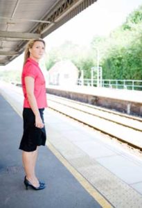 Woman standing on the passenger train platform